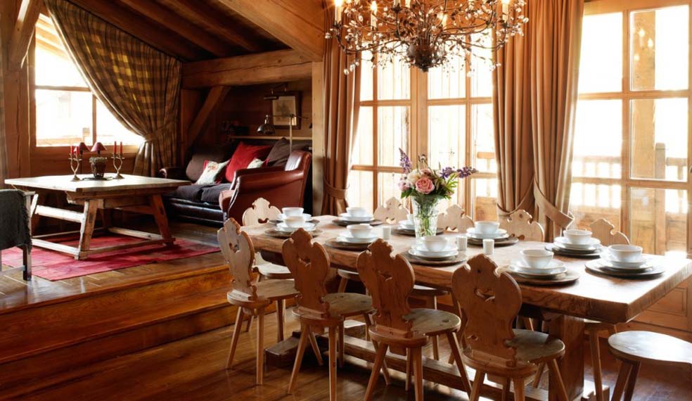 The table is set for a fine dining experience in a luxury chalet in the Alps