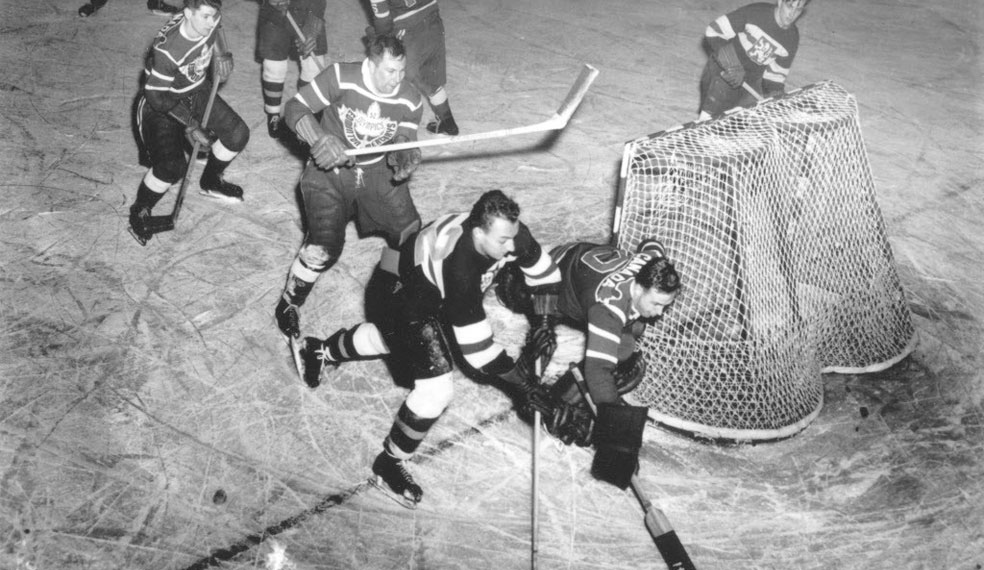 An ice hockey game at one of the early Winter Olympics
